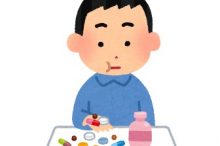 薬を飲む人。